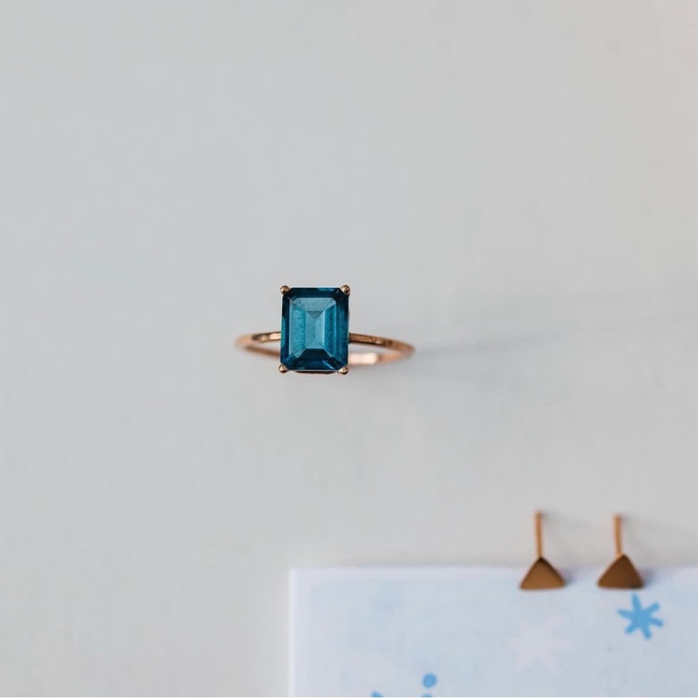London Blue Topaz set in solid 14k yellow gold. Size 6. Slightly over 1 carat